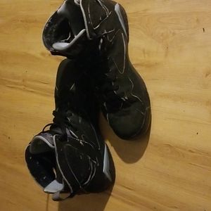 Light blue an black Jordan's